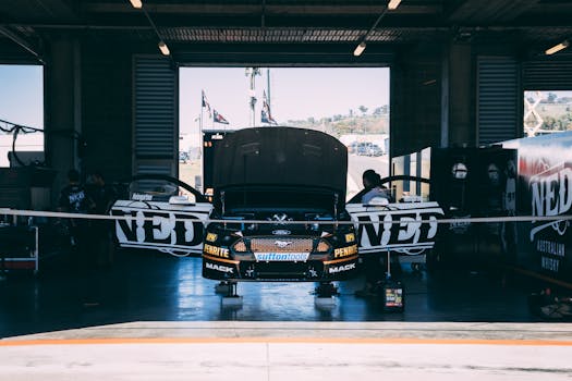 Race car under maintenance at Mount Panorama, NSW. Perfect for racing and automotive themes.